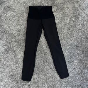 Pair of size 4 LuLulemon black capri leggings with lace trim detail